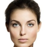 Woman with blue eyes and dark hair, Jaw Feminization Surgery, Beverly Hills CA,