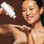 Female skincare routine with facial serum treatment